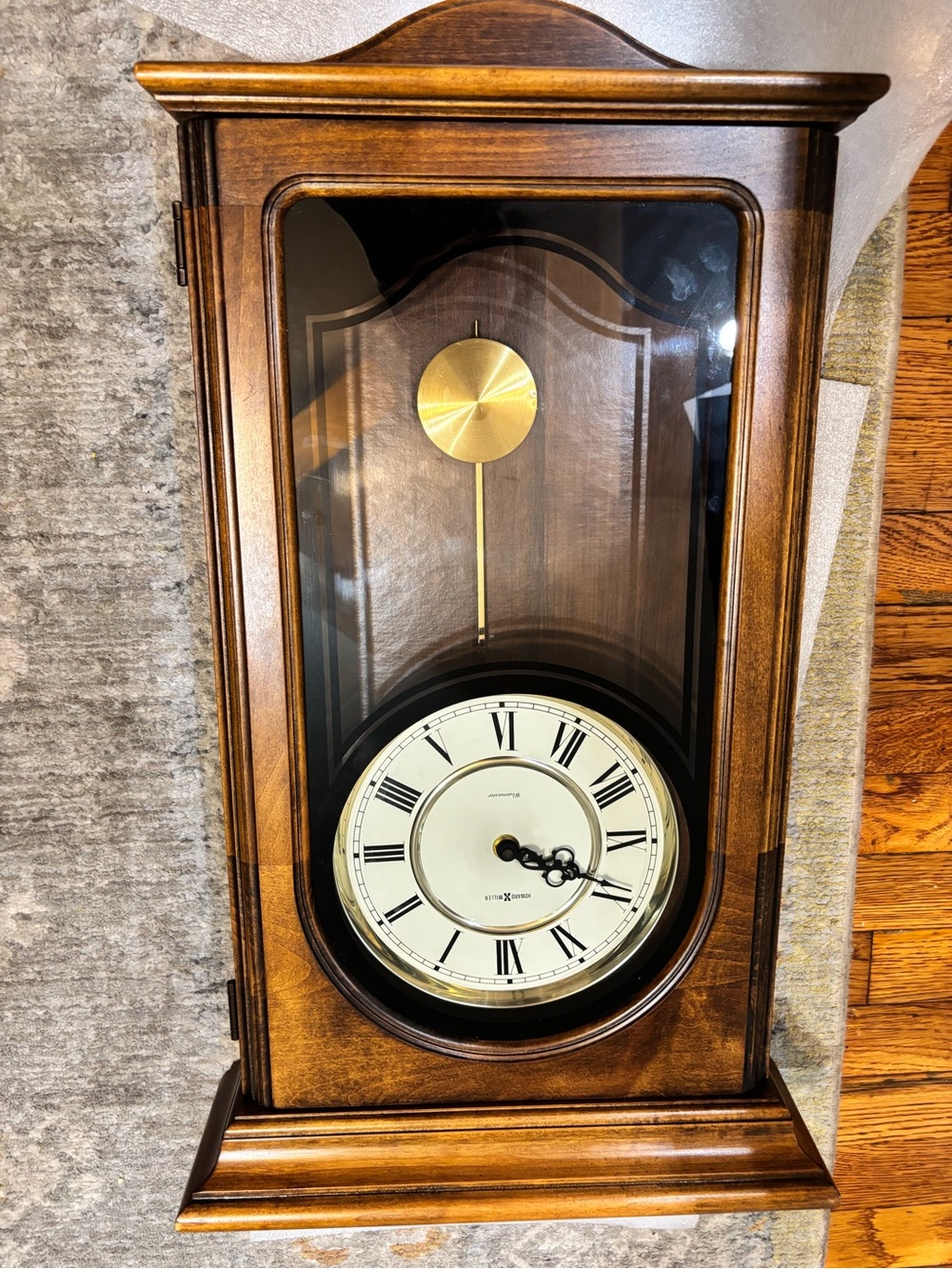Traditional Brown Wall Pendulum Clock with Gold Accents